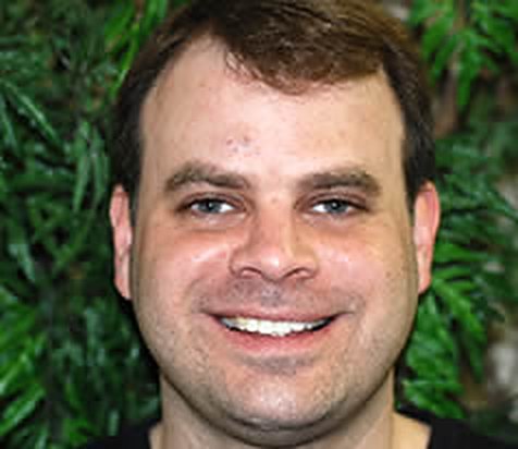 After: John T.'s smile, natural-looking front teeth, not retouched